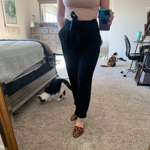 Business casual pants with tie and pockets.